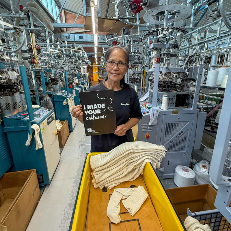 A woman in a factory with a 